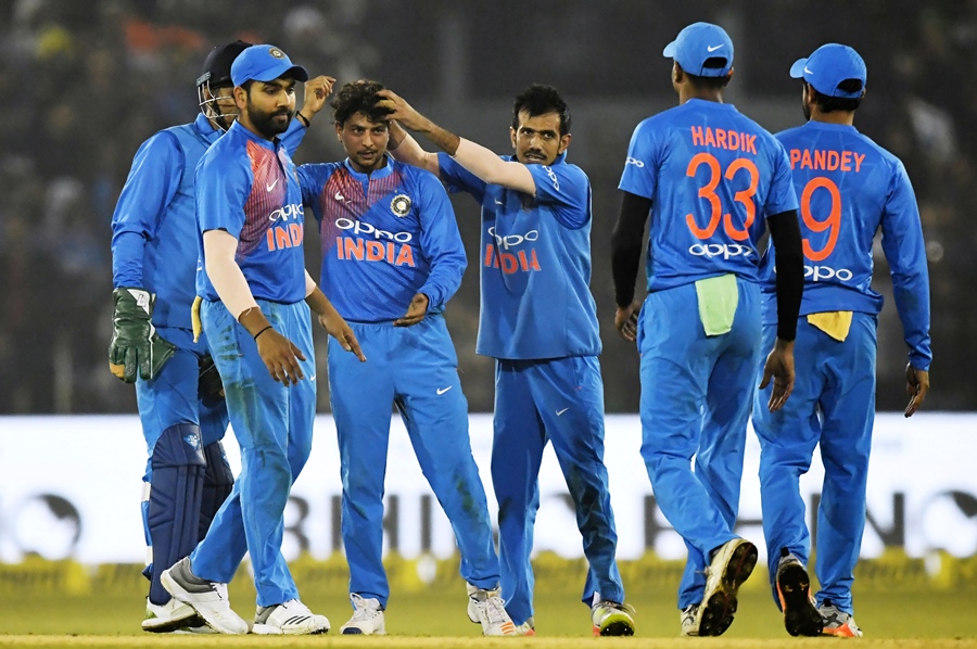 india 039 s yuzvendra chahal c with others congratulate teammate kuldeep yadav 3l after he took the wicket of unseen sri lankan batsman dasun shanaka during the first t20 international cricket match between india and sri lanka at the barabati stadium in cuttack on december 20 2017 photo afp