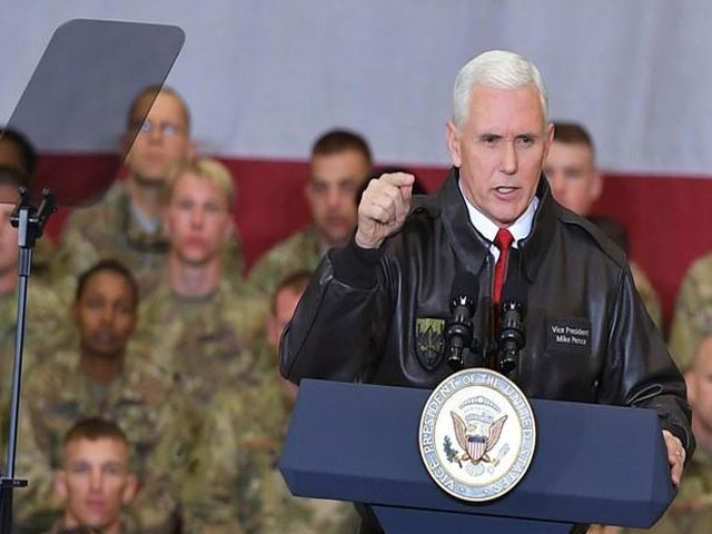 us vice president mike pence arrives on stage to address troops in a hangar at bagram air field in afghanistan on december 21 2017 photo reuters