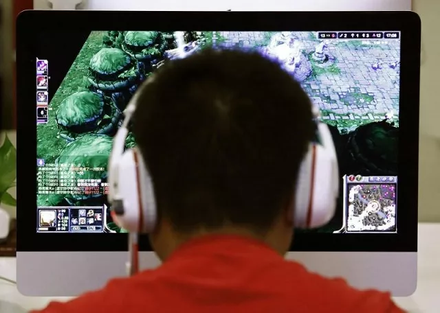 a man plays a computer game at an internet cafe in beijing may 9 2014 photo reuters a man plays a computer game at an internet cafe in beijing may 9 2014 photo reuters
