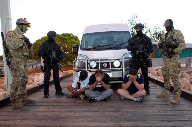 a supplied image from the australian federal police shows three people who were arrested with an alleged record haul of 1 2 tonnes of methamphetamine at the port of geraldton located north of the city of perth in western australia december 21 2017 photo via reuters