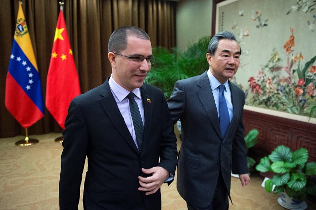 venezuelan foreign minister jorge arreaza l walks with china 039 s foreign minister wang yi at the ministry of foreign affairs in beijing on december 22 2017 photo reuters