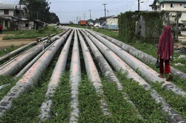 file photo a girl walks on a gas pipeline running through okrika community near nigeria 039 s oil hub city of port harcourt december 4 2012 photo reuters file photo a girl walks on a gas pipeline running through okrika community near nigeria 039 s oil hub city of port harcourt december 4 2012 photo reuters