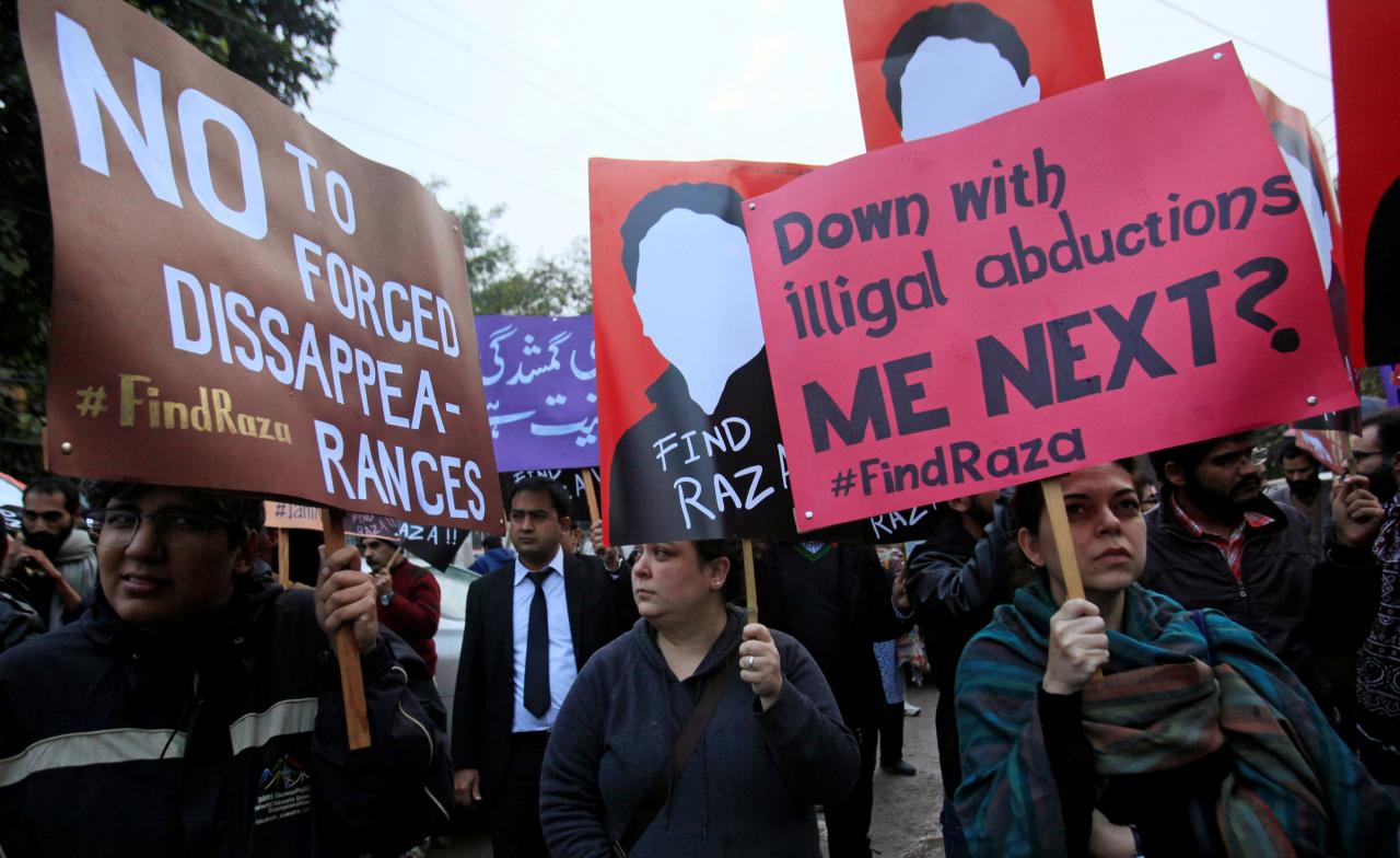 demonstrators hold placards calling for the release of raza mehmood khan a member of aghaz i dosti start of friendship a group that works on peace building between pakistan and india during a protest in lahore photo reuters