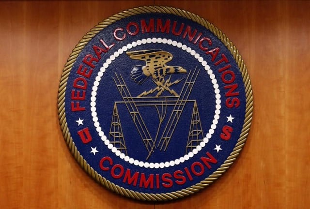 the federal communications commission fcc logo is seen before the fcc net neutrality hearing in washington february 26 2015 photo reuters