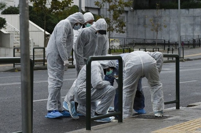 the bomb was inside a backpack left at the building 039 s entrance by two men who then fled in a small van a police source told afp photo afp