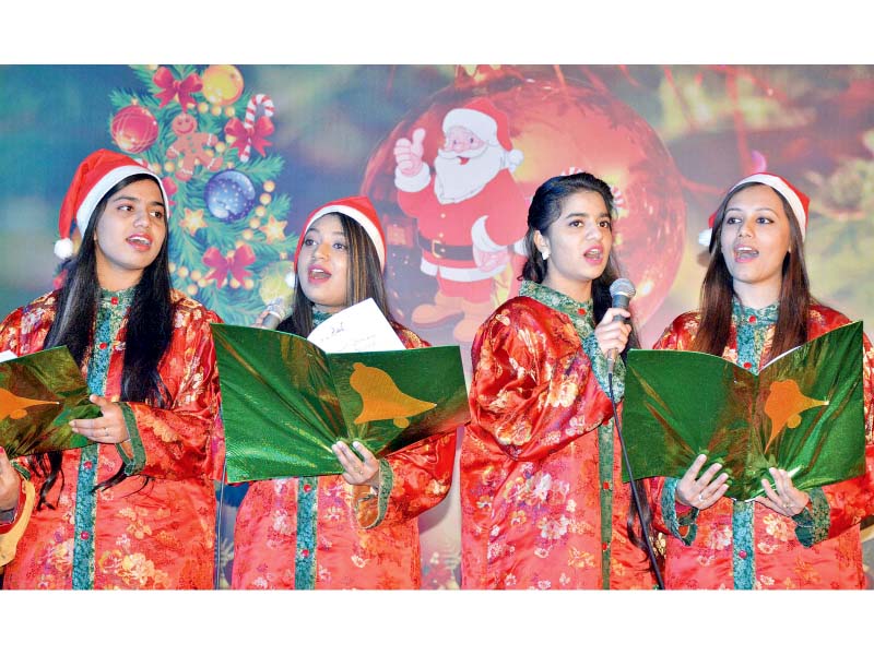 girls sing carols at a ceremony hosted by pnca photo inp