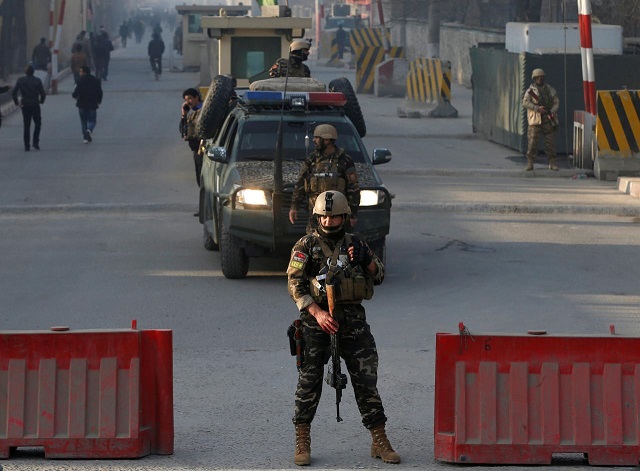 afghan security forces keep watch at a check point close to the compound of afghanistan 039 s national intelligence agency in kabul afghanistan december 25 2017 photo reuters