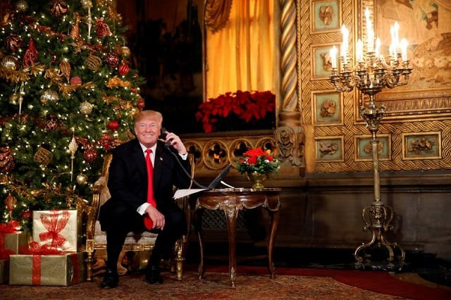 us president donald trump participates in norad north american aerospace defense command santa tracker phone calls with children at mar a lago estate in palm beach florida us december 24 2017 photo reuters
