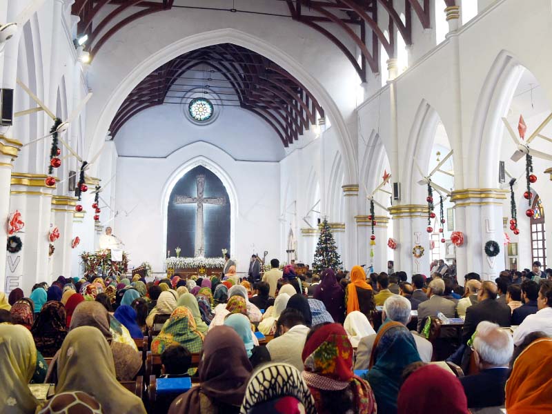 christians attend christmas day mass at a church in peshawar photo afp