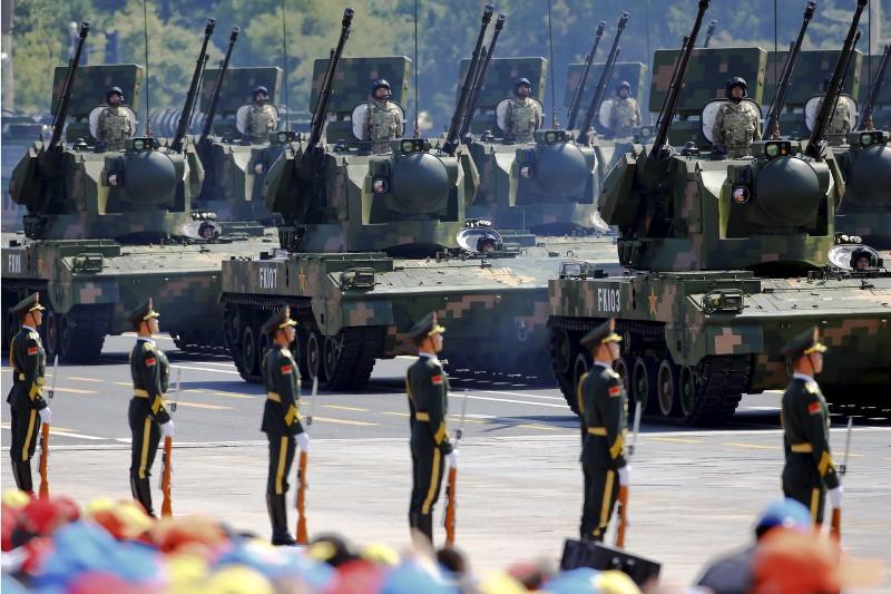 china 039 s people 039 s liberation army pla soldiers on their armoured vehicles equipped with anti aircraft artillery roll to tiananmen square during the military parade marking the 70th anniversary of the end of world war two in beijing china photo reuters