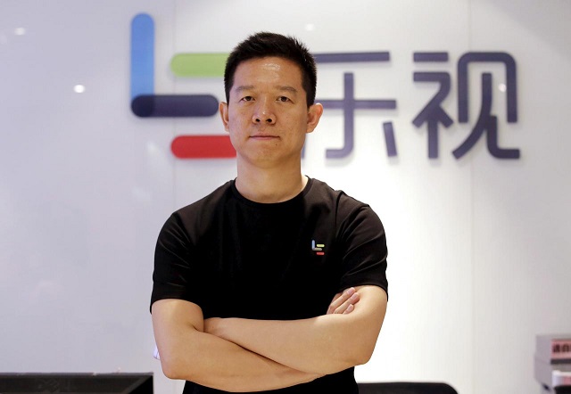 jia yueting co founder and head of le holdings also known as leeco and formerly as letv poses for a photo in front of a logo of his company after a reuters interview at leeco headquarters in beijing china april 22 2016 photo reuters