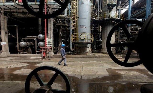 file photo a worker walks past oil pipes at a refinery in wuhan hubei province march 23 2012 photo reuters file photo a worker walks past oil pipes at a refinery in wuhan hubei province march 23 2012 photo reuters