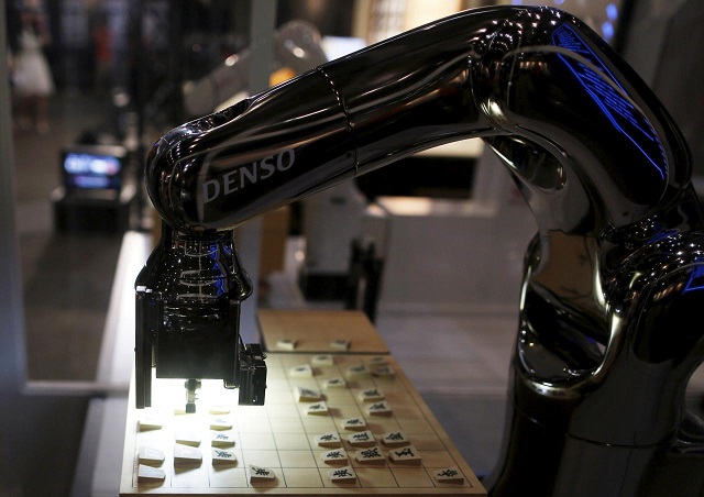 denso corp 039 s robot arm quot denoute san quot plays japanese chess also known as shogi at a booth during niconico chokaigi 2015 in makuhari east of tokyo japan april 26 2015 photo reuters