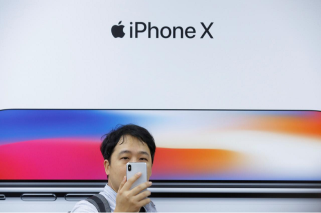 an attendee uses a new iphone x during a presentation for the media in beijing china october 31 2017 photo reuters