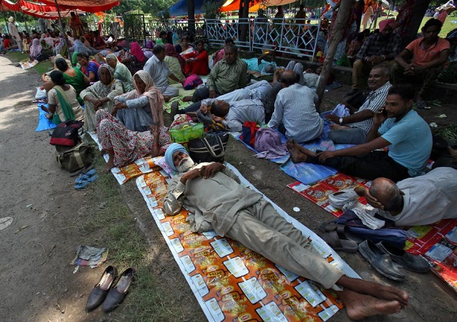 file photo supporters of gurmeet ram rahim singh rest as they gather near a stadium in panchkula in haryana august 24 2017 photo reuters