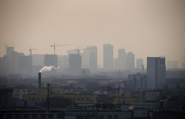 file photo smoke rises from a chimney among houses as new high rise residential buildings are seen under construction on a hazy day in the city centre of tangshan hebei province in this february 18 2014 file photo photo reuters file photo smoke rises from a chimney among houses as new high rise residential buildings are seen under construction on a hazy day in the city centre of tangshan hebei province in this february 18 2014 file photo photo reuters