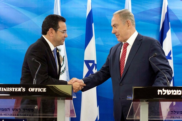 file photo guatemalan president jimmy morales and israeli prime minister benjamin netanyahu shake hands as they deliver statements to the media during their meeting in jerusalem november 29 2016 reuters abir sultan file photo