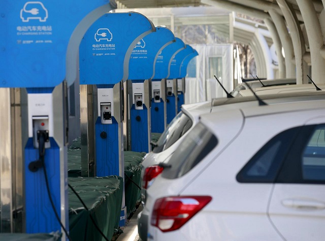 an electric vehicle ev charging station is seen at a factory of beijing electric vehicle funded by the baic group in beijing china january 18 2016 photo reuters