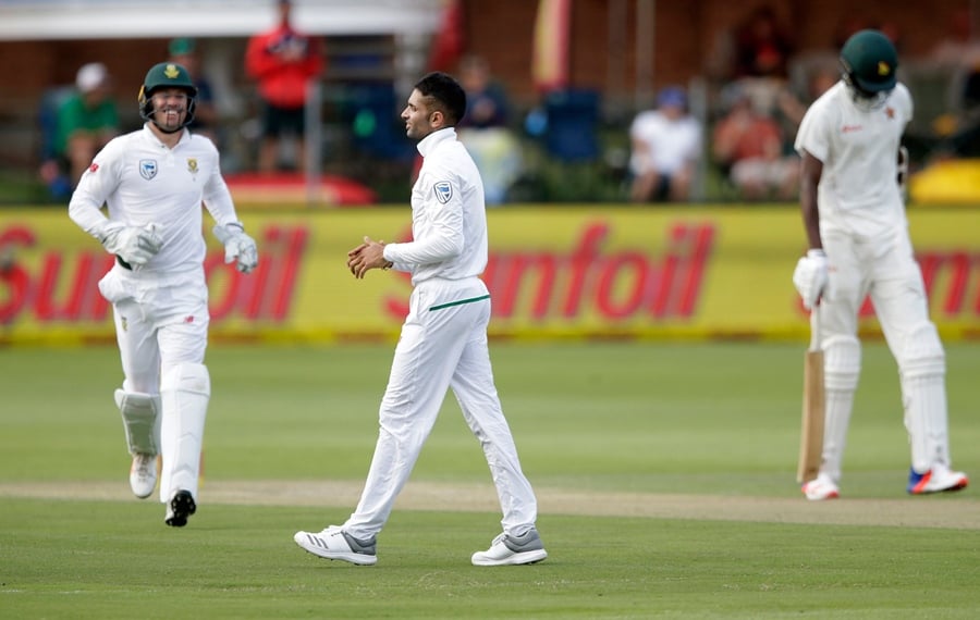 south african bowler keshav maharaj c celebrates the dismissal of zimbabwean batsman blessing muzarabani r during the second day of the day night test cricket match between south africa and zimbabwe at st george 039 s park cricket ground in port elizabeth on december 27 2017 zimbabwe were forced to follow on after being bowled out for 68 on the second day of their one off day night test against south africa photo afp