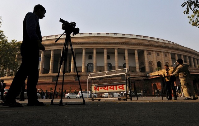 file photo television journalists report from the premises of india 039 s parliament in new delhi february 13 2014 photo reuters