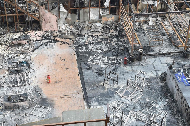 view of a burned building where a rooftop party was being held in mumbai early on december 29 2017 fire tore through a mumbai building where a rooftop party was being held early on december 29 killing at least 15 people and leaving many injured police said photo afp view of a burned building where a rooftop party was being held in mumbai early on december 29 2017 fire tore through a mumbai building where a rooftop party was being held early on december 29 killing at least 15 people and leaving many injured police said photo afp