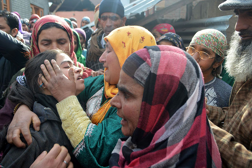 the villagers consoling one of the orphans photo news18