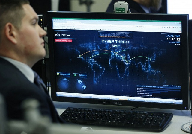 a department of homeland security worker listens to president barack obama talk at the national cybersecurity and communications integration center in arlington virginia january 13 2015 photo reuters