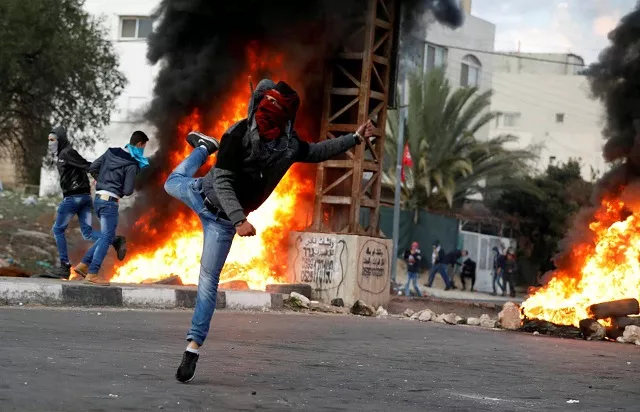 a palestinian demonstrator hurls stones toward israeli troops during clashes at a protest against us president donald trump 039 s decision to recognize jerusalem as the capital of israel near the west bank city of nablus december 29 2017 photo reuters a palestinian demonstrator hurls stones toward israeli troops during clashes at a protest against us president donald trump 039 s decision to recognize jerusalem as the capital of israel near the west bank city of nablus december 29 2017 photo reuters