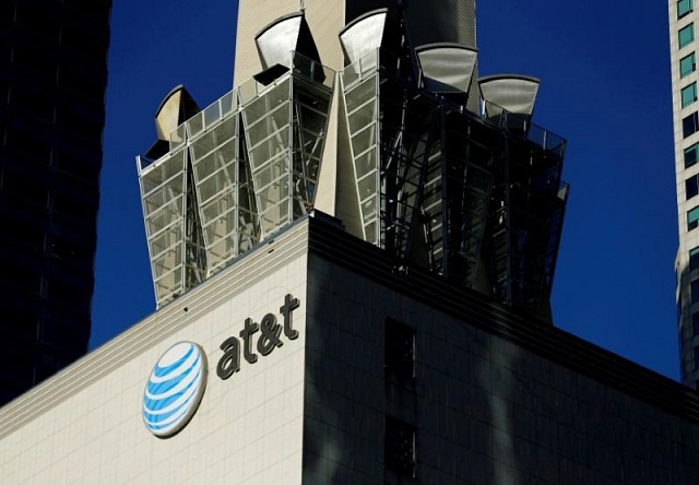 an at amp t logo and communication equipment is shown on a building in downtown los angeles california october 29 2014 photo reuters