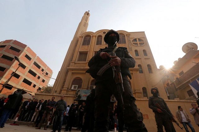 security forces stand guard at the site of attack on a church in the helwan district south of cairo egypt december 29 2017 photo reuters