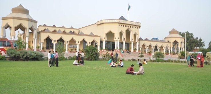 a file photo of students sitting on a university campus photo hired pk