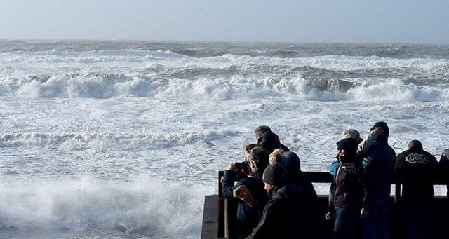 people watch waves during the storm carmen in lacanau southwestern france on january 1 2018 photo afp people watch waves during the storm carmen in lacanau southwestern france on january 1 2018 photo afp