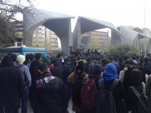 people protest near the university of tehran iran december 30 2017 in this picture obtained from social media photo reuters