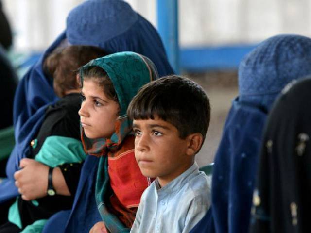 afghan refugees wait at the unhcr registration centre in peshawar on june 23 2016 photo afp