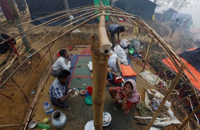 file photo a rohingya refugee family eats as they sit inside their semi constructed shelter at kutupalong refugee camp near cox 039 s bazar bangladesh october 24 2017 photo reuters
