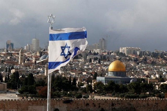 file photo an israeli flag is seen near the dome of the rock located in jerusalem 039 s old city on the compound known to muslims as noble sanctuary and to jews as temple mount december 6 2017 photo reuters