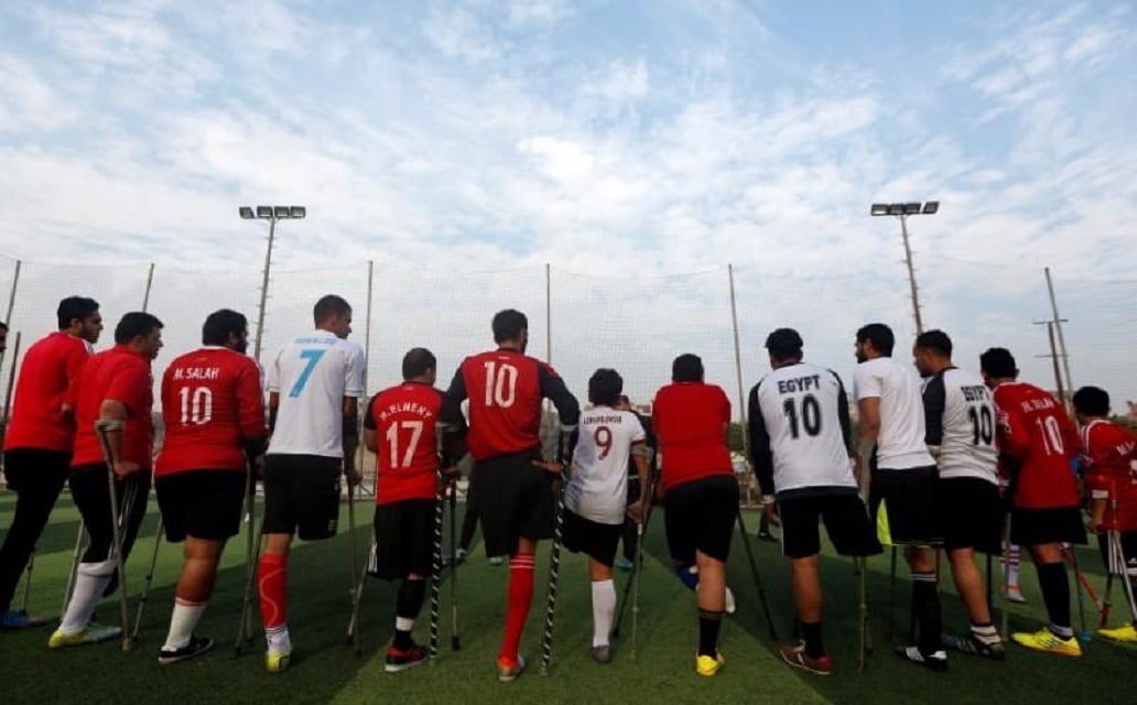 members of quot miracle team quot a soccer team made up of one legged crutch bearing soccer players listen to their coach before a training session at el salam club on the outskirts of cairo egypt december 29 2017 photo reuters