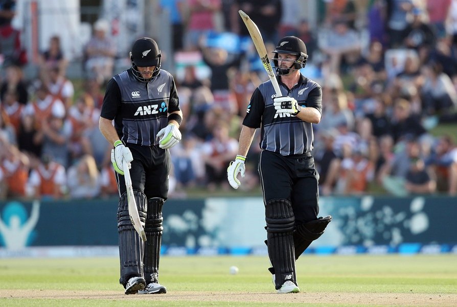 new zealand 039 s colin munro r celebrates his half century with teammate martin guptill l during the third twenty20 international cricket match between new zealand and the west indies at bay oval in mount maunganui on january 3 2018 photo afp