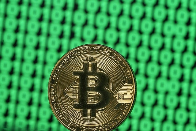 a token of the virtual currency bitcoin is seen placed on a monitor that displays binary digits in this illustration picture december 8 2017 photo reuters a token of the virtual currency bitcoin is seen placed on a monitor that displays binary digits in this illustration picture december 8 2017 photo reuters