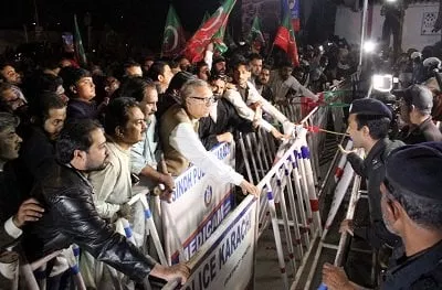 according to pti leader imran ismail five party workers were injured during baton charge by police photo athar khan express