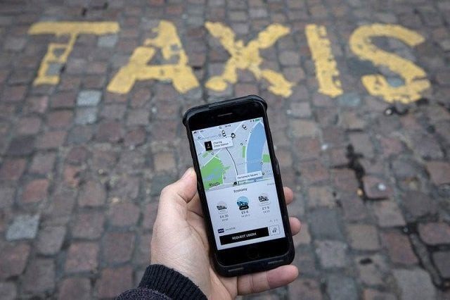 a photo illustration shows the uber app on a mobile telephone as it is held up for a posed photograph in london britain november 10 2017 photo reuters a photo illustration shows the uber app on a mobile telephone as it is held up for a posed photograph in london britain november 10 2017 photo reuters
