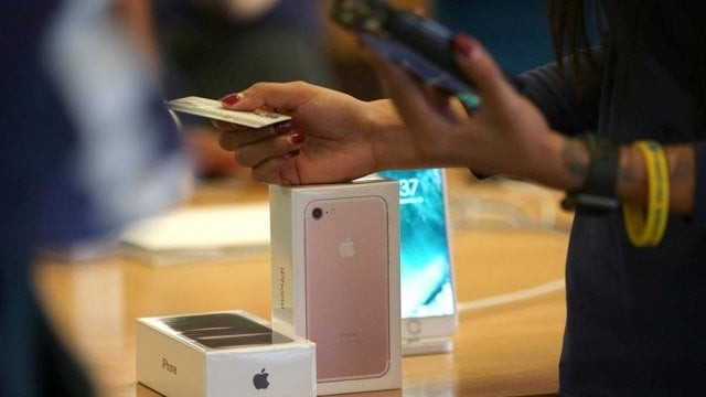 apple iphones at a retail outlet as a customer buys it photo reuters apple iphones at a retail outlet as a customer buys it photo reuters