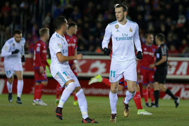 real madrid 039 s welsh forward gareth bale r celebrates a goal with real madrid 039 s spanish midfielder lucas vazquez during the spanish copa del rey king 039 s cup round of 16 first leg football match cd numancia vs real madrid cf at nuevo estadio los pajaritos stadium in soria on january 4 2018 photo afp real madrid 039 s welsh forward gareth bale r celebrates a goal with real madrid 039 s spanish midfielder lucas vazquez during the spanish copa del rey king 039 s cup round of 16 first leg football match cd numancia vs real madrid cf at nuevo estadio los pajaritos stadium in soria on january 4 2018 photo afp