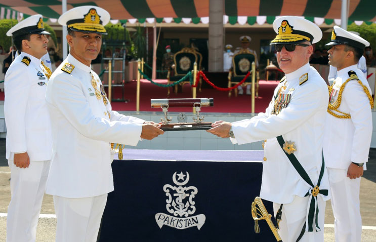 admiral zafar mehmood abbasi presenting the traditional command scroll to newly appointed chief of the naval staff admiral amjad khan niazi hi m during impressive change of command ceremony at pns zafar islamabad photo courtesy pakistan navy