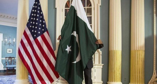 a state department contractor adjust a pakistan national flag before a meeting at the state department in washington photo reuters