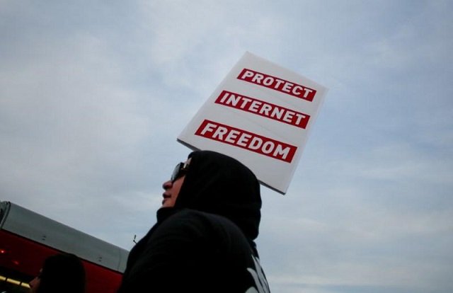 a supporter of net neutrality lance brown eyes protests the fcc 039 s recent decision to repeal the program in los angeles california november 28 2017 photo reuters