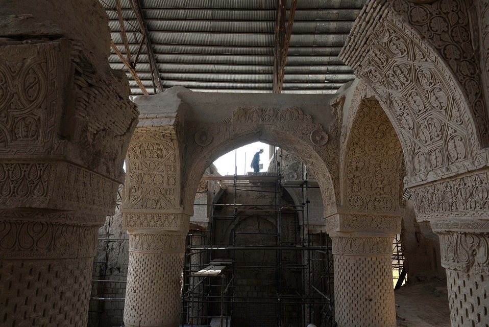 in this photograph taken on november 8 2017 shows an afghan labourer working at the ninth century mosque masjid e haji piyada mosque of the walking pilgrim in balkh province in the white dusty plains of northern afghanistan archeologists and conservationists are seeking to unravel the secrets of an one of the oldest mosques in the world whose structure is still standing after a thousand years of solitude photo afp