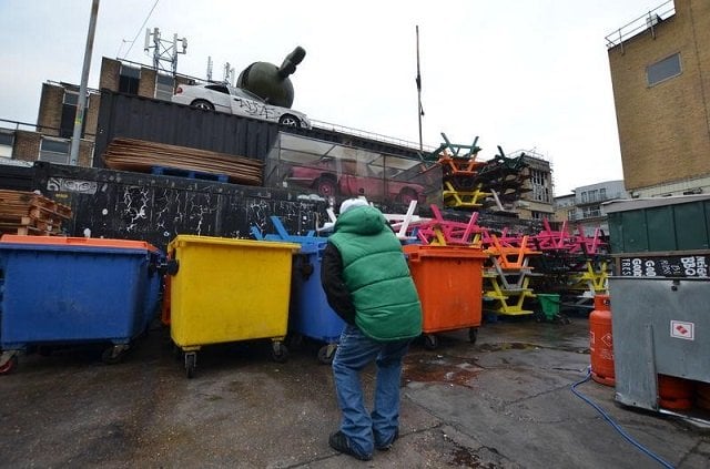 pete a homeless man working as a tourist guide for social enterprise unseen tours points at a street art installation near brick lane london britain on november 11 2017 photo reuters