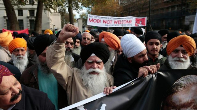 british sikhs protesting against the visit of prime minister narendra modi outside downing street in london photo reuters british sikhs protesting against the visit of prime minister narendra modi outside downing street in london photo reuters