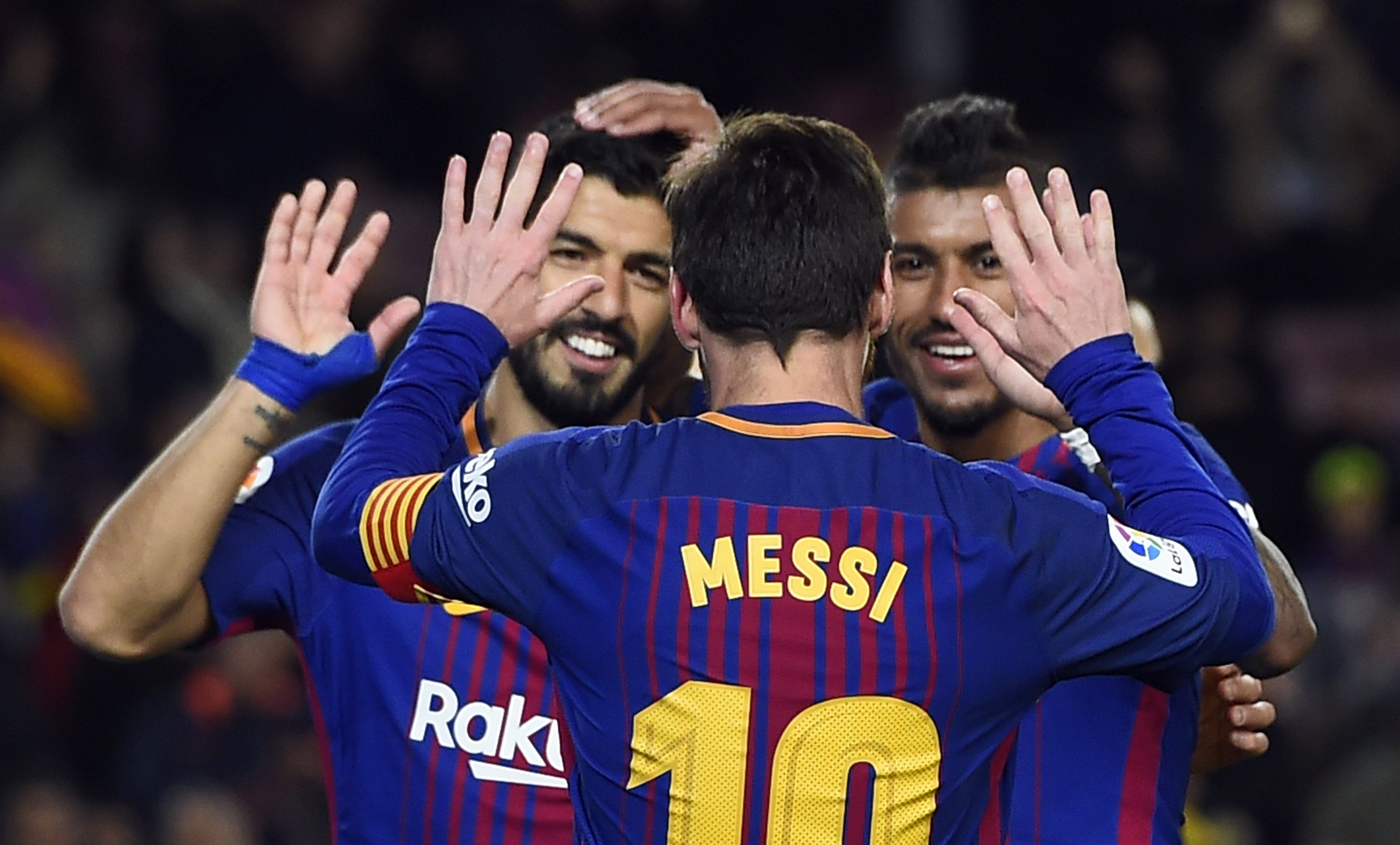 paulinho r celebrates his goal with messi and suarez l as all three got on the scoresheet in a comfortable 3 0 win photo afp
